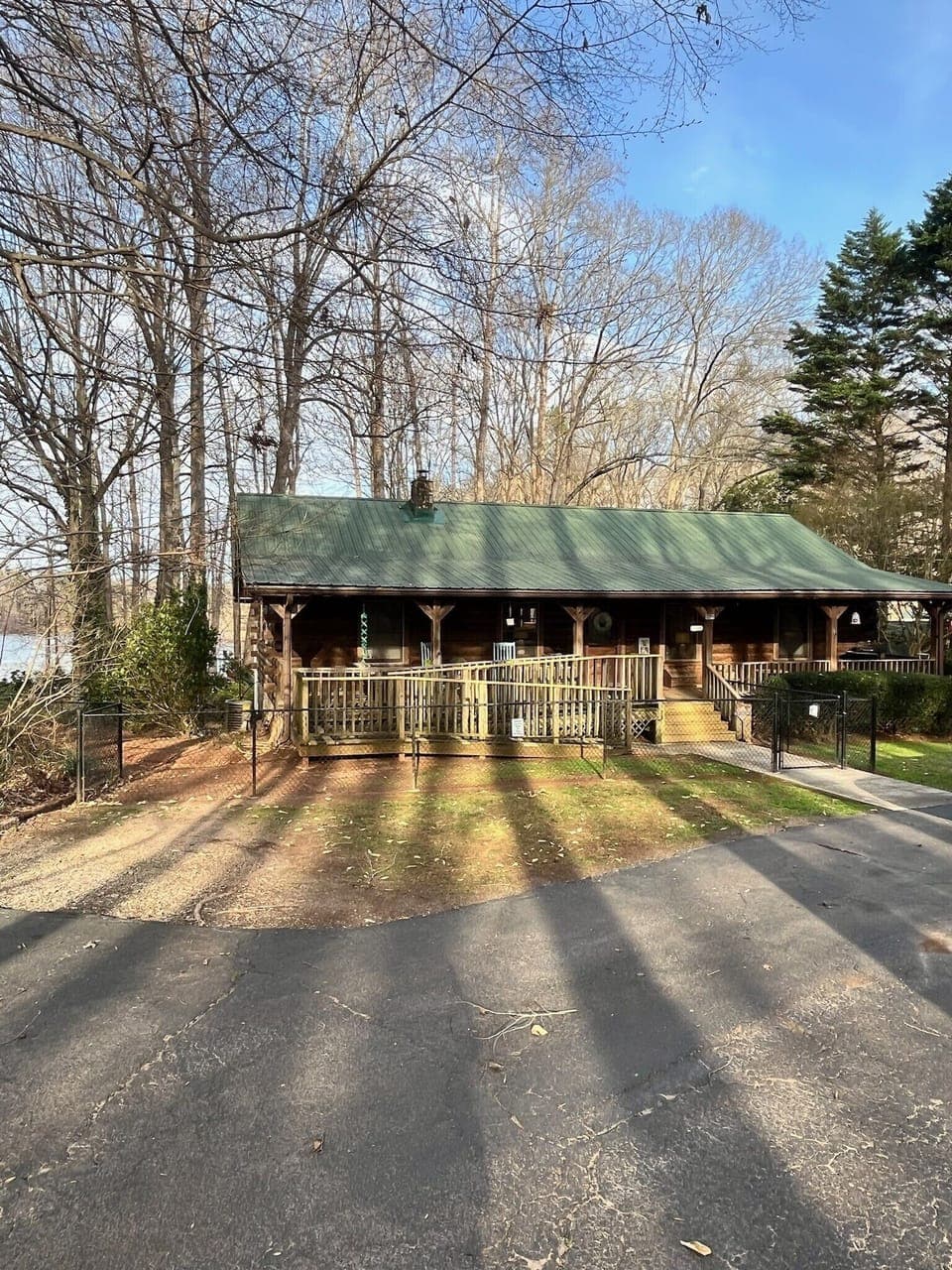 The cabin! Handicap ramp leads to the front door. Fenced yard for furry friends!