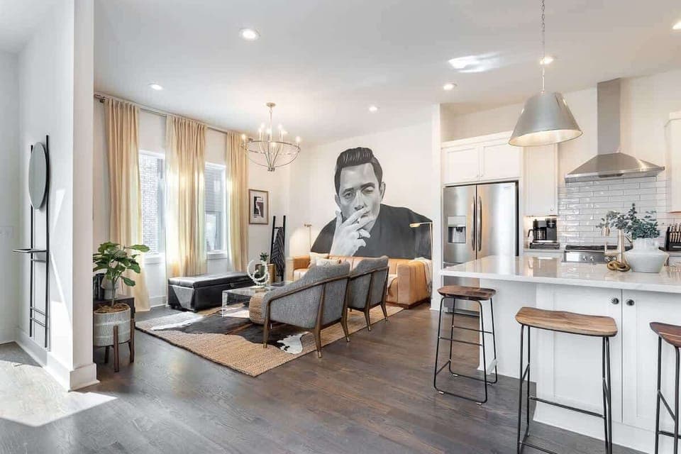 Living room featuring a bold mural of Johnny Cash for a unique artistic touch.
