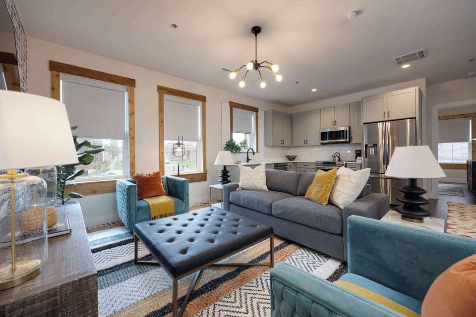 Embrace the comfort and sophistication of our modern living room setup, complete with comfortable couches and a trendy coffee table - the ideal setting for making memories with family and friends.