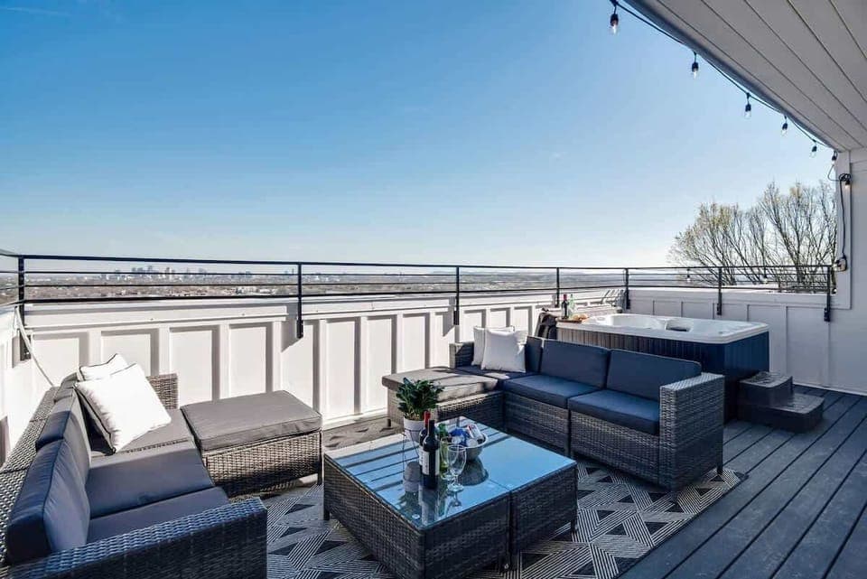 Rooftop retreat with hot tub and breathtaking skyline vistas.