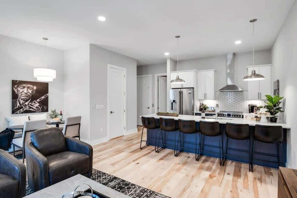 Open design allows everyone to cook, eat, and relax together.