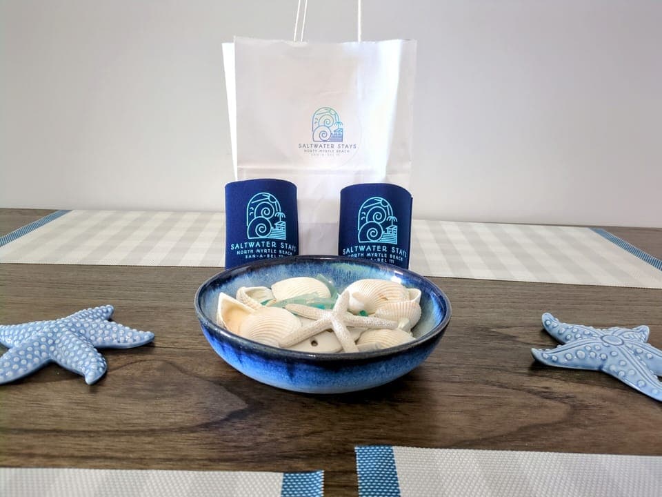 Who doesn't love a good koozie for the beach! Ask about our welcome kit.

