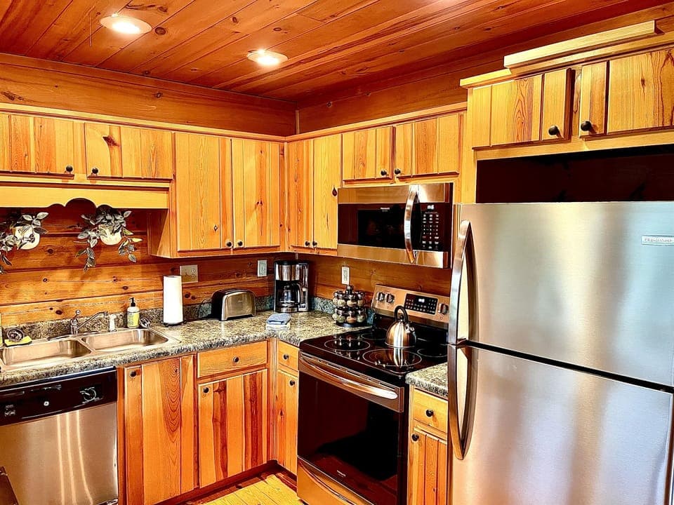 The entry level of each townhouse contains a kitchen, dining area, & bedroom w/ ensuite bathroom (view of Ruby's kitchen).