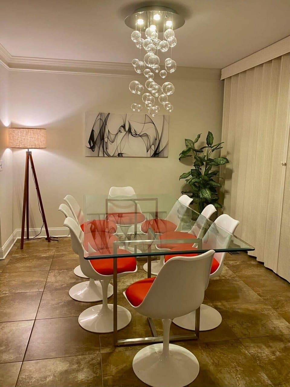 Entertain with Ease - The 8-seater dining room table, adjacent to the back deck, is perfect for hosting memorable dinners with loved ones, surrounded by the beauty of nature.