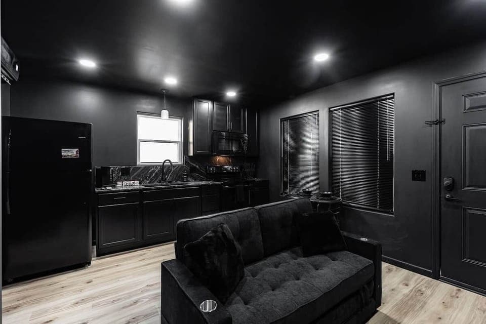 Couch in living room and kitchen