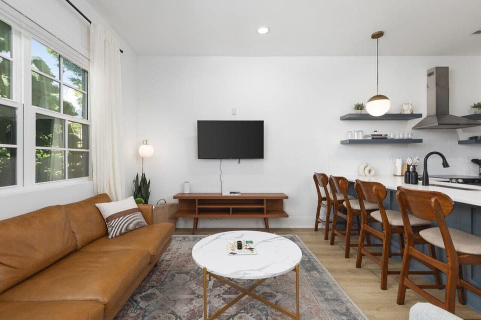 Lots of natural light in the living room with a Smart TV & all the streaming apps. Open floor plan flows into the kitchen area.