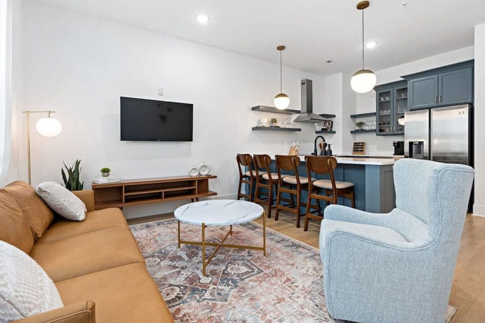 Lots of natural light in the living room with a Smart TV & all the streaming apps. Open floor plan flows into the kitchen area.