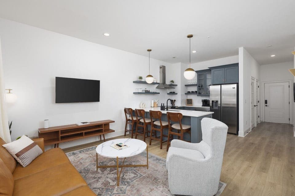 Lots of natural light in the living room with a Smart TV & all the streaming apps. Open floor plan flows into the kitchen area.
