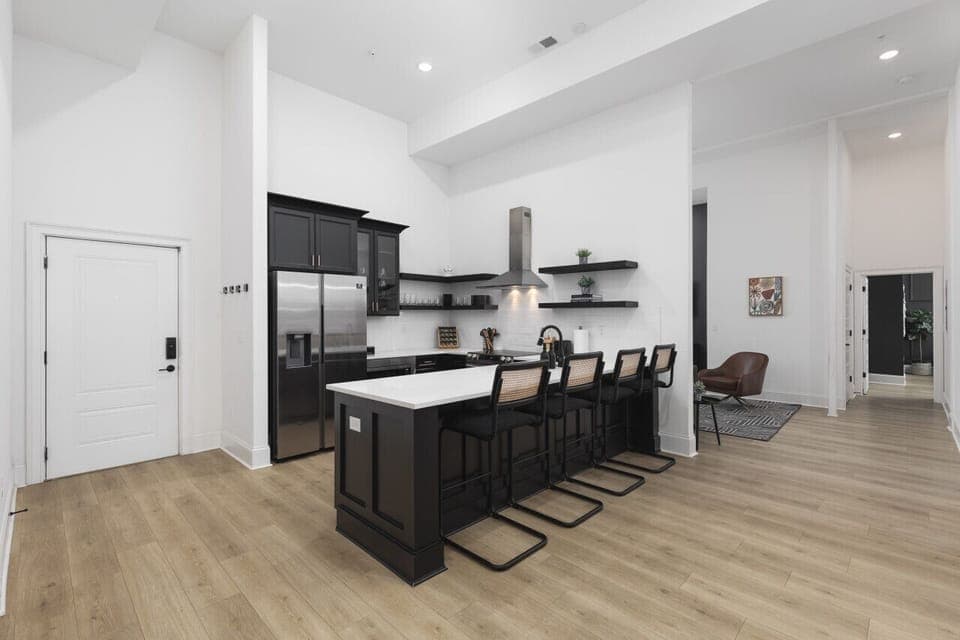 The kitchen is fully stocked with high-end appliances and every utensil, dish, and spice you might need to make a meal. Seating for four available at the counter.
