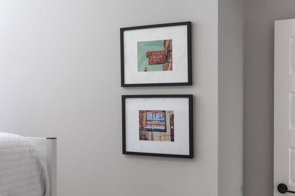 Thoughtfully selected artwork in bedroom #2 to make your stay feel memorable and homey.
