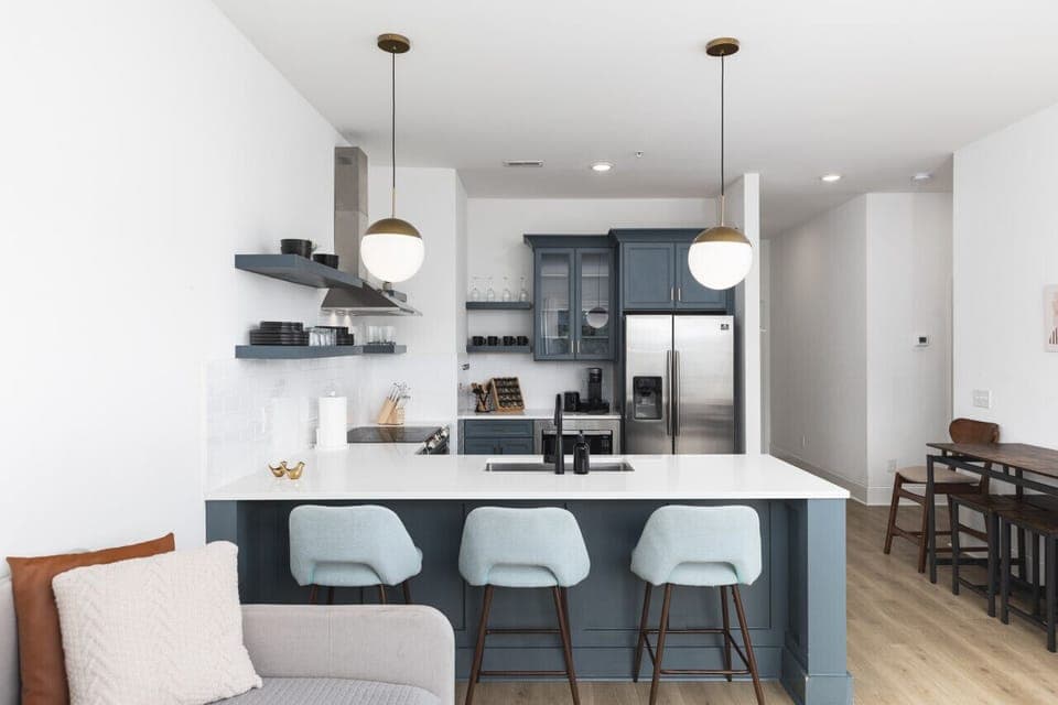 Fully-stocked kitchen for all your cooking needs! There is also a separate high-top dining table with seating for 4.