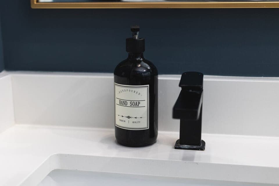 Primary bedroom's ensuite bath with a standing shower. All shower essentials and towels are provided.