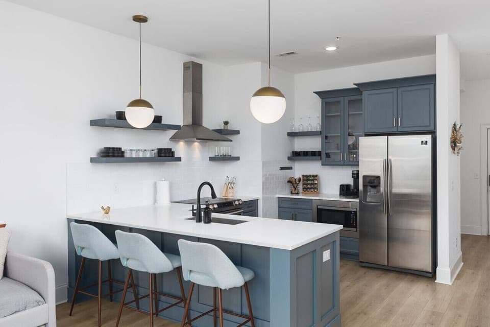 Fully-stocked kitchen for all your cooking needs! There is also a separate high-top dining table with seating for 4.
