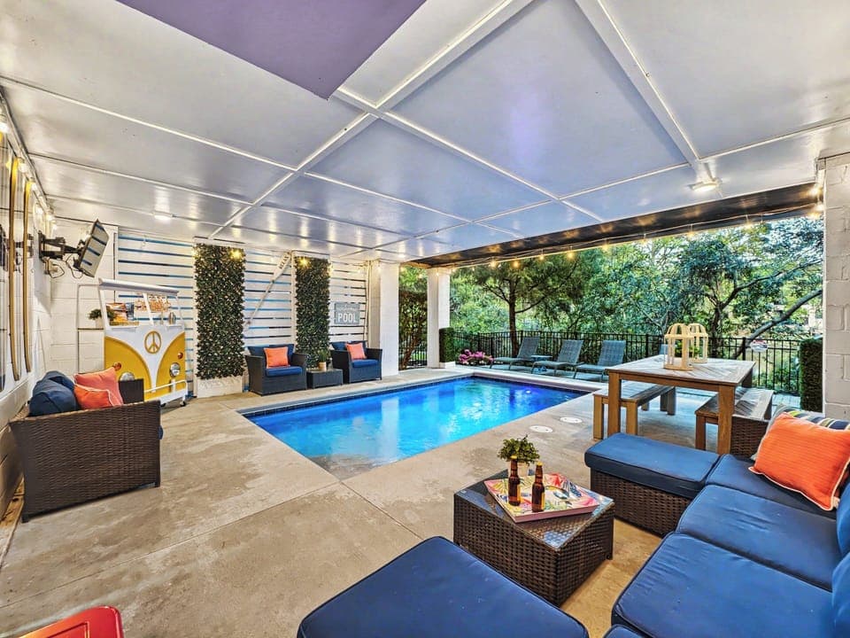 Heated pool in a fun setting with ample seating for guests to enjoy the outdoors after a memorable day at Folly Fields beach on Hilton Head Island.