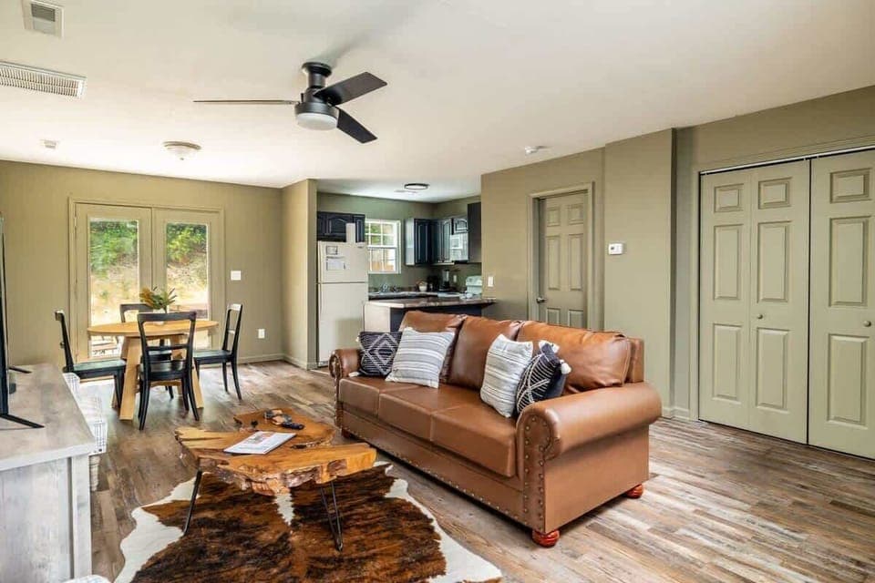 Our living area is definitely the ultimate relaxation spot. From the inviting couch to the soothing breeze of the ceiling fan, it's the perfect place to unwind after a long day.
