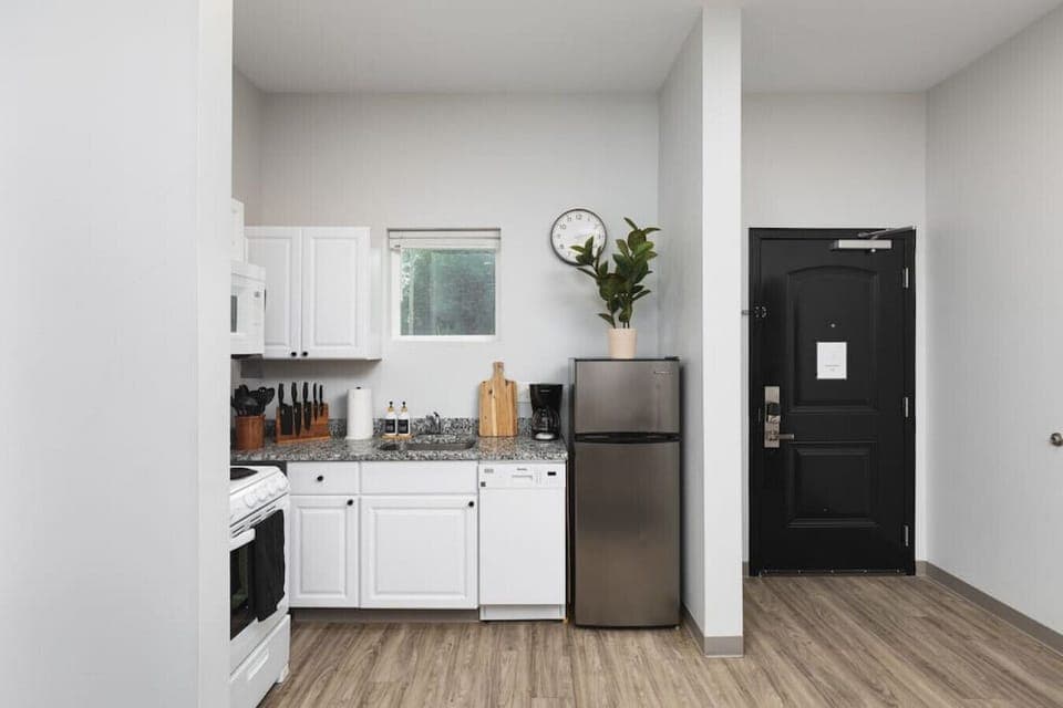 Fully-stocked kitchen off of the dining area with everything you'll need to cook and make yourself at home.
