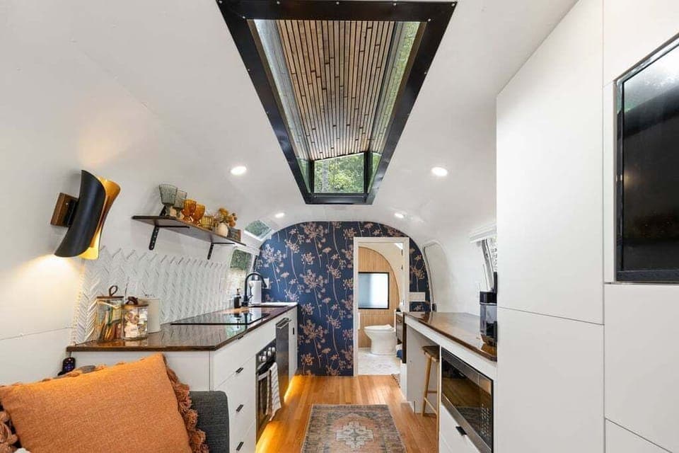 You are going to love the raised ceiling and sky light.  Just wait until you see the uplighting at night in the skylight!