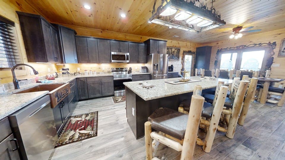 Kitchen with bar and chairs