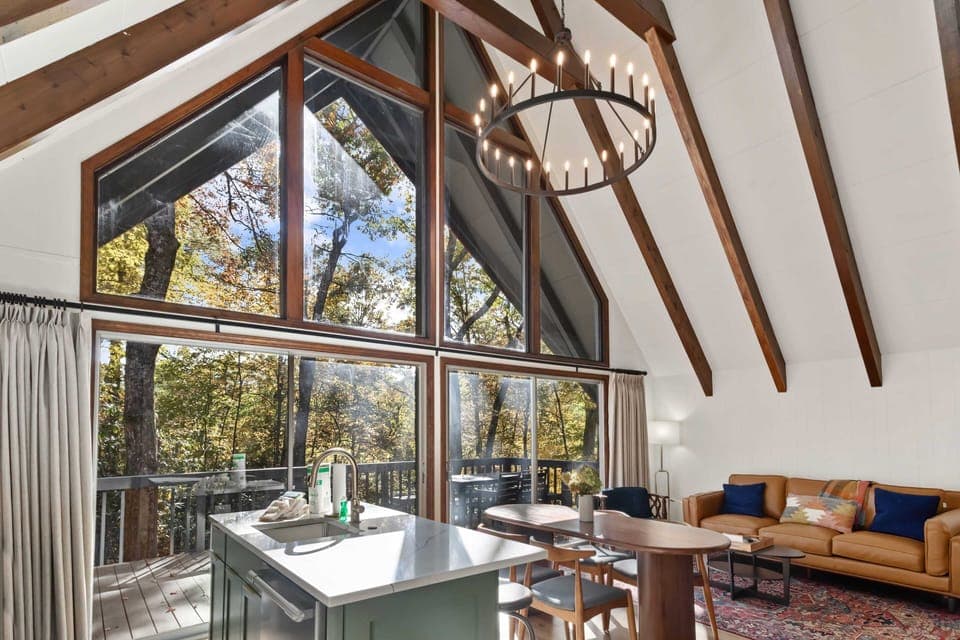Great Room with a Wall of Glass Doors and Windows Letting in Natural Light