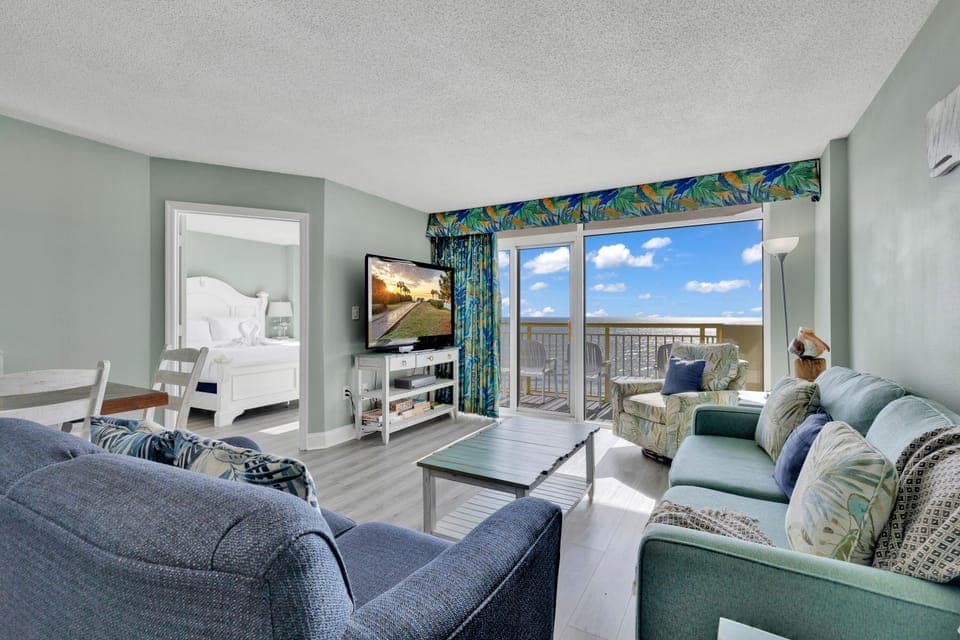 Signature Condo, 3 Bedrooms, Balcony, Ocean View | Living room | 65-inch Smart TV with cable channels