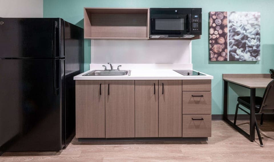 Suite, 2 Queen Beds, Non Smoking | Private kitchen | Full-size fridge, microwave, stovetop