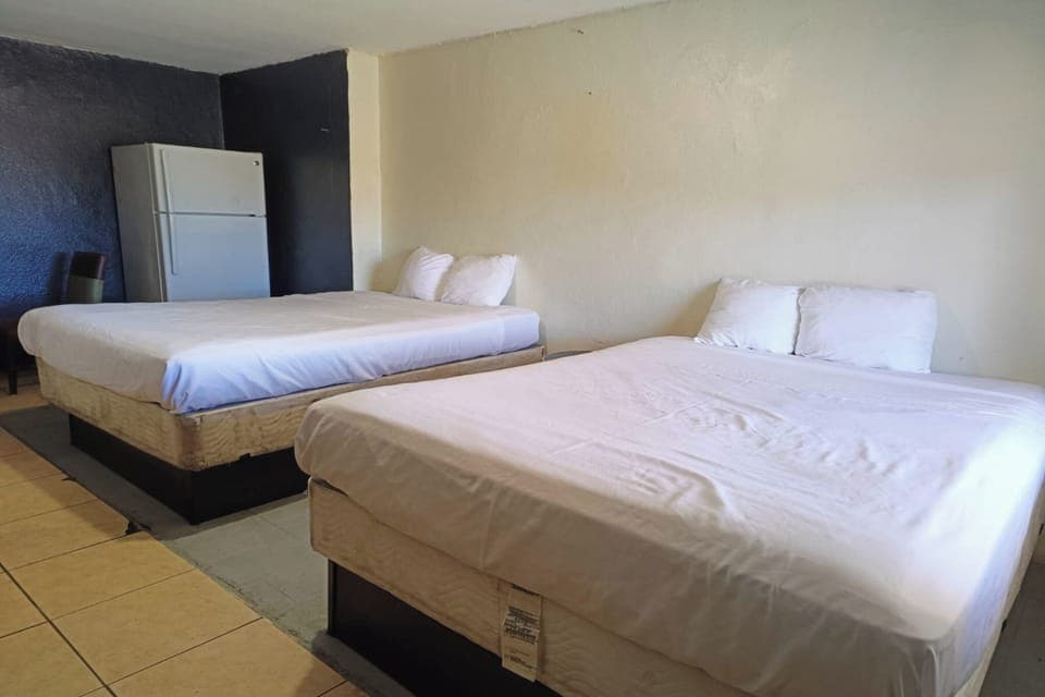 Room, 2 Queen Beds, Kitchenette | Desk, free rollaway beds, free WiFi, bed sheets
