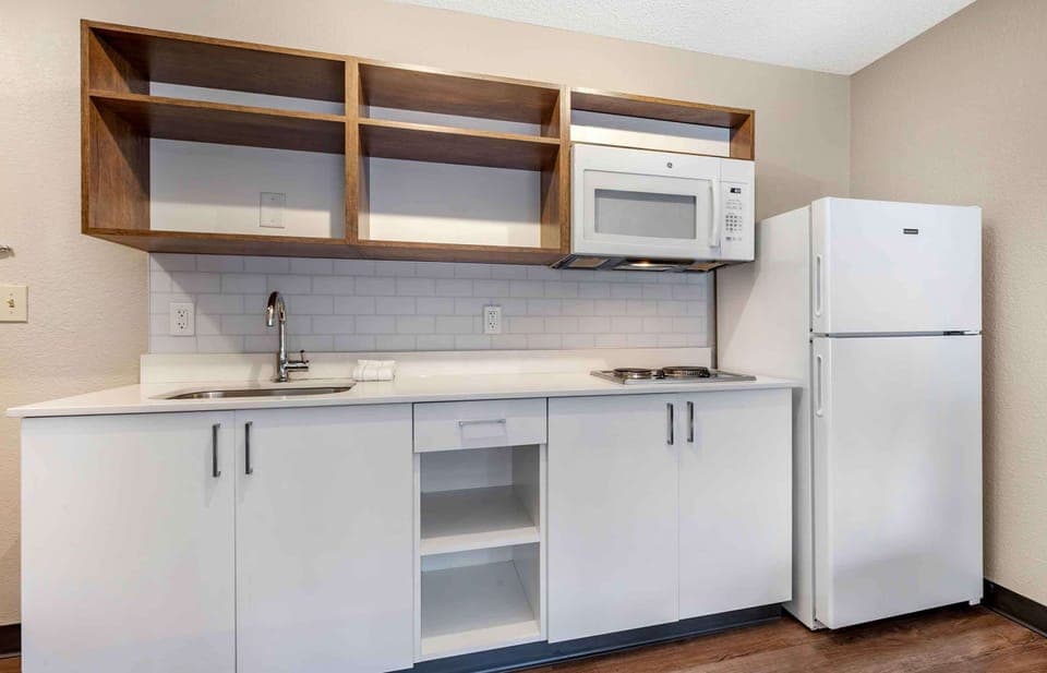 Suite, 1 King Bed, Non Smoking (1 Bedroom) | Private kitchen | Full-size fridge, microwave, stovetop, coffee/tea maker
