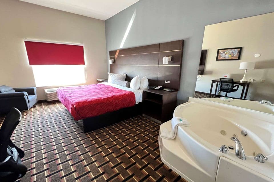 Suite, 1 King Bed, Non Smoking, Hot Tub | Desk, laptop workspace, iron/ironing board, free cribs/infant beds