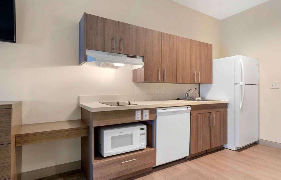 Studio, 2 Queen Beds, Non Smoking | Private kitchen | Full-size fridge, microwave, stovetop, cookware/dishes/utensils