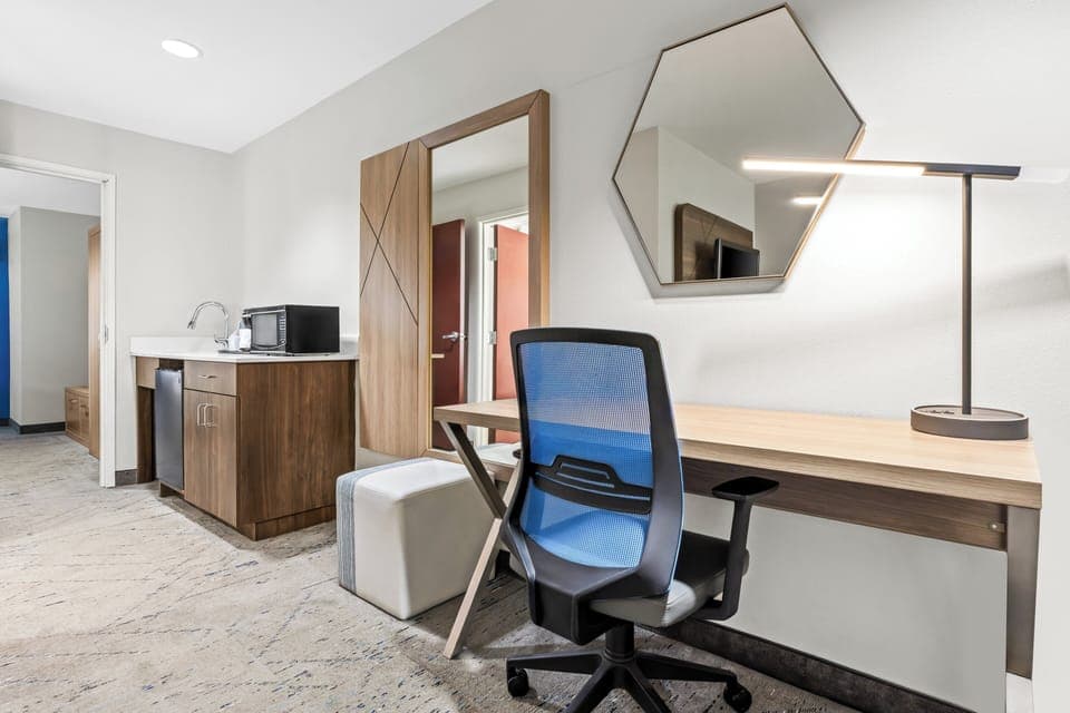 Suite, 1 King Bed | Desk, blackout drapes, iron/ironing board, free WiFi