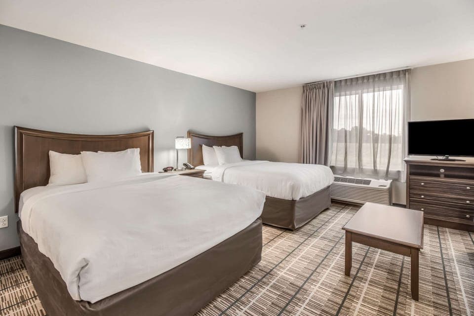Suite, 2 Queen Beds, Non Smoking | Individually furnished, desk, laptop workspace, blackout drapes