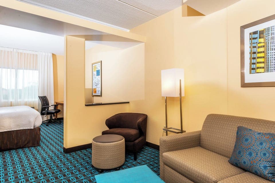 Suite, 1 King Bed with Sofa bed | Living area | Flat-screen TV