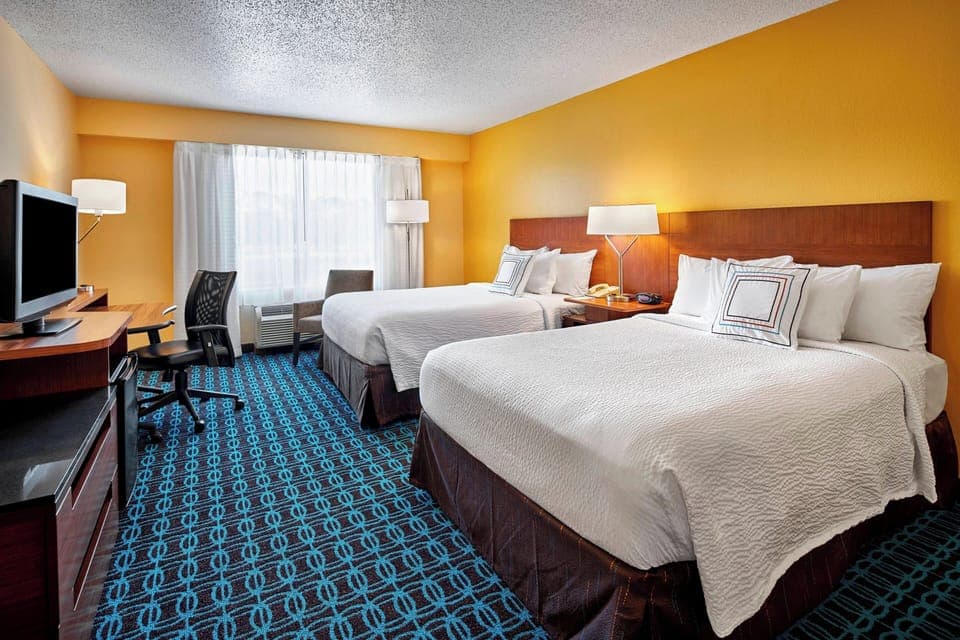 Room, 2 Double Beds | In-room safe, desk, iron/ironing board, free cribs/infant beds