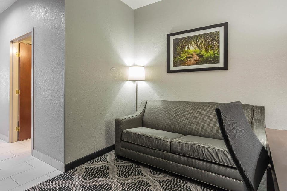 Desk, laptop workspace, blackout drapes, iron/ironing board