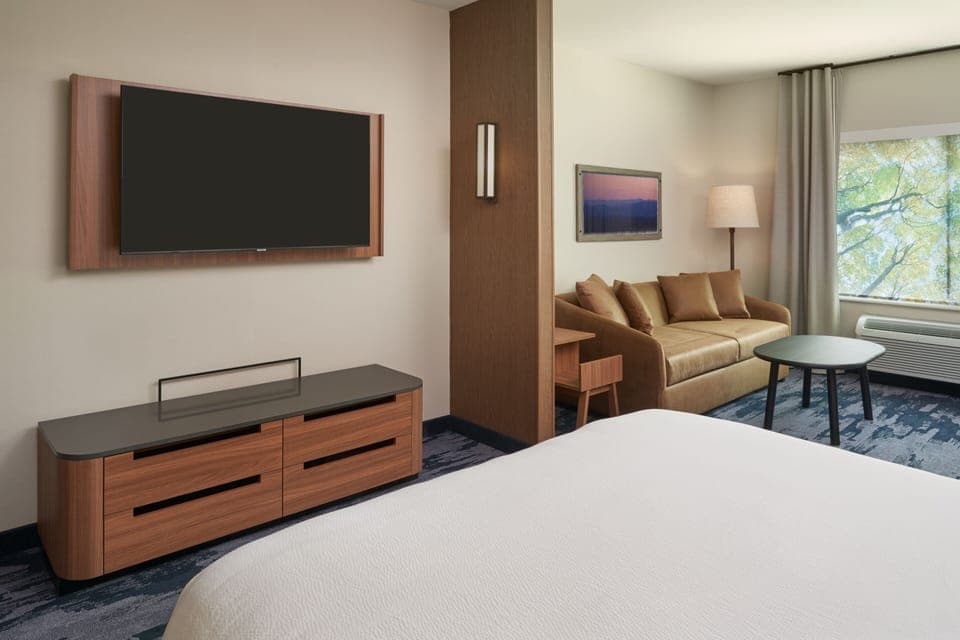 Suite, 1 King Bed with Sofa bed | Desk, blackout drapes, iron/ironing board, free cribs/infant beds