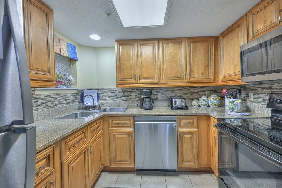 Condo, 2 Bedrooms, Balcony, Partial Ocean View (223) | Private kitchen | Microwave, coffee/tea maker, toaster, cleaning supplies