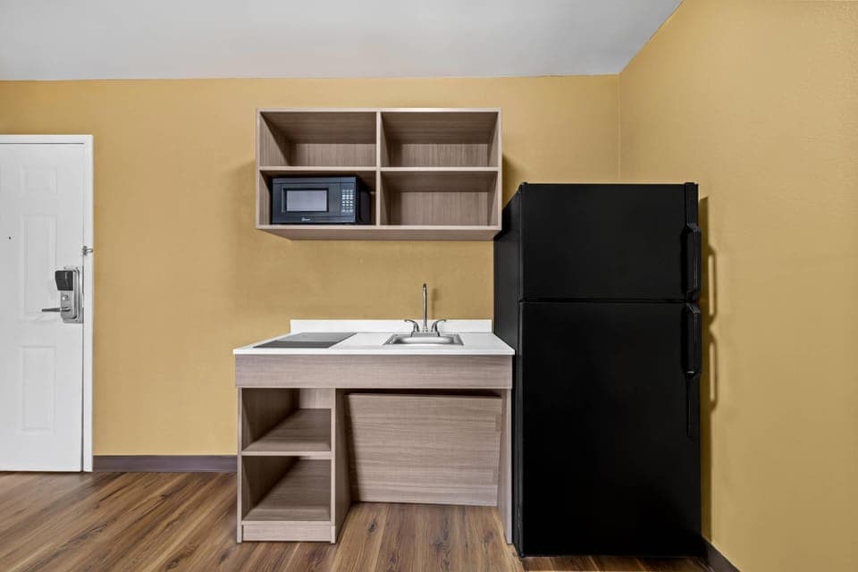 Desk, laptop workspace, blackout drapes, iron/ironing board
