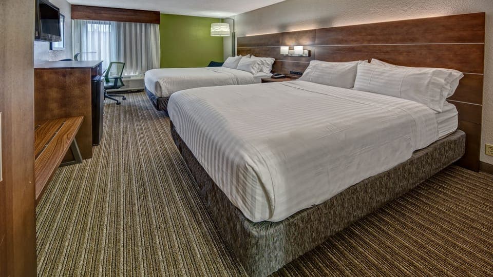 Down comforters, pillowtop beds, in-room safe, desk