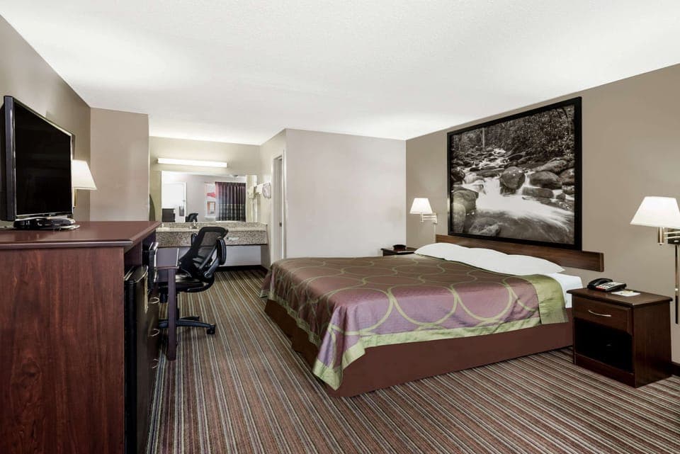 Desk, laptop workspace, blackout drapes, iron/ironing board
