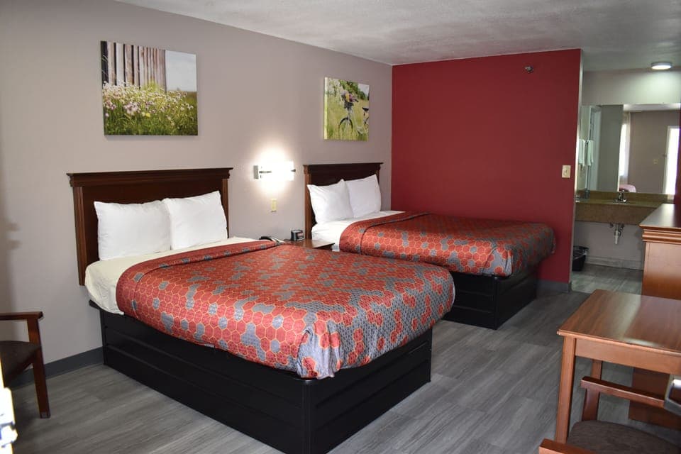 Room, 2 Double Beds | Desk, blackout drapes, iron/ironing board, rollaway beds