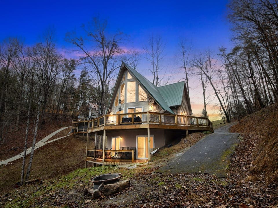 Exterior of home facing the lake with two-tier decks and a stunning view of the lake