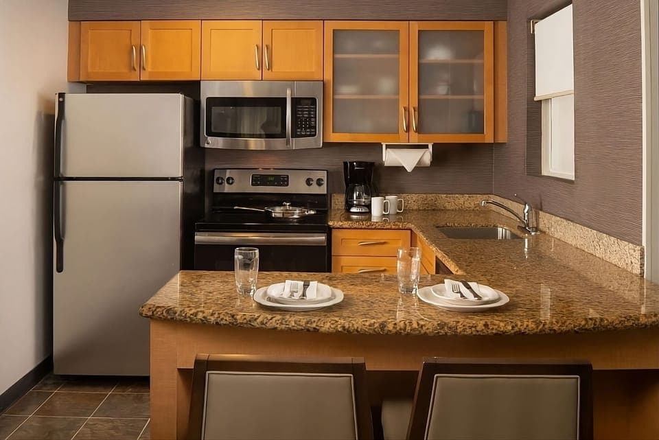 Cook easy meals with full kitchen appliances and granite counters.