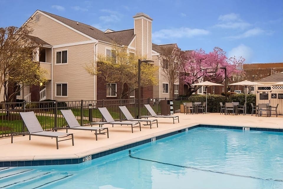 Soak up sunshine poolside, then lounge on a shaded chair.