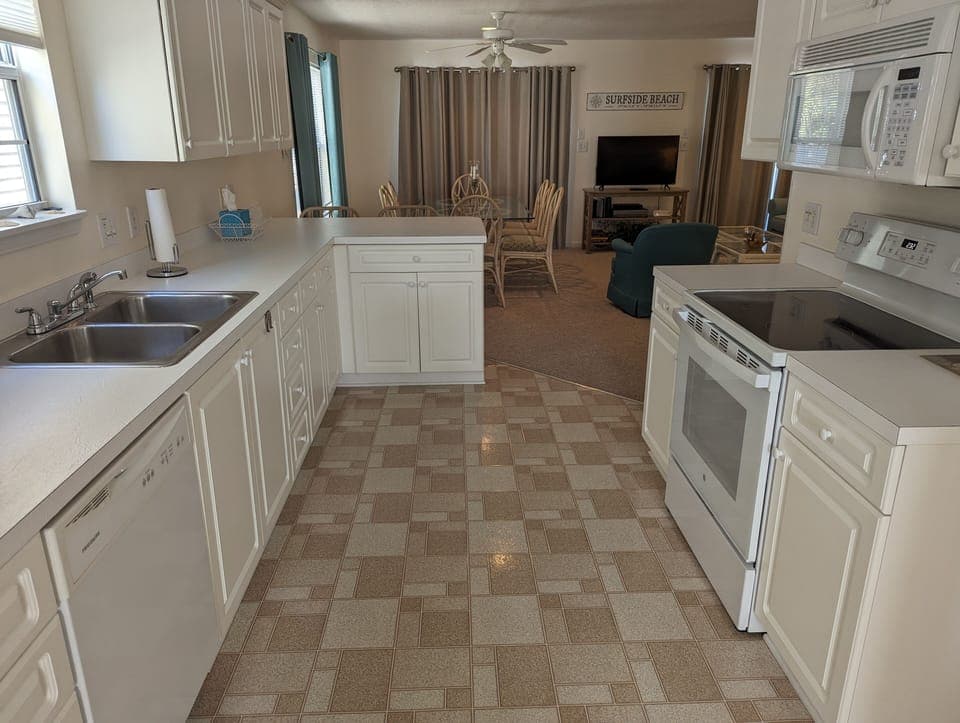 Kitchen opens to the dining room and living area.