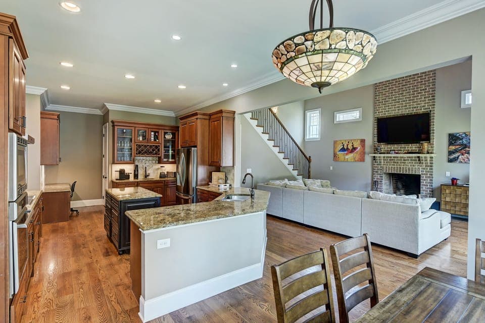 Dock Holiday's elegant kitchen seamlessly integrated with the living room.