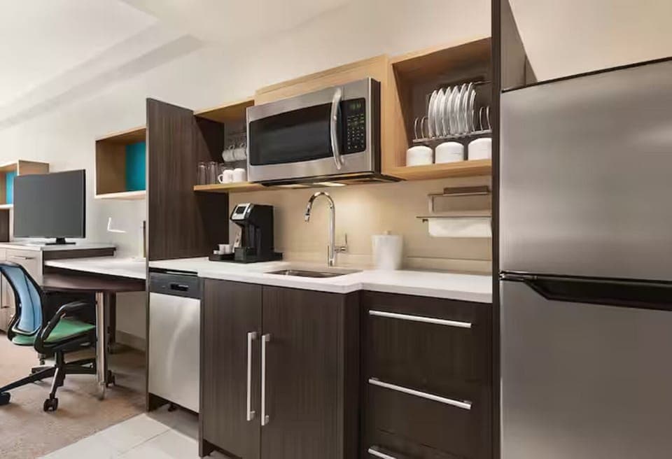 Brew morning coffee and prep snacks in the kitchenette.