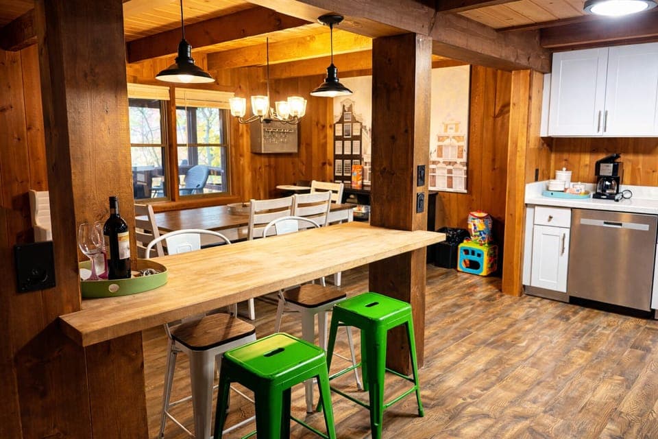 Gather for meals, morning coffee, or evening wine at the breakfast bar while the dining table nearby makes the perfect spot for family dinners.