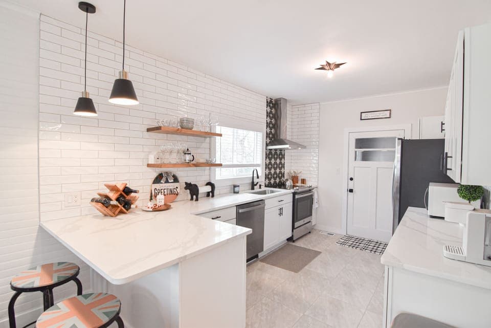 Breakfast bar with outlet makes a great space to pull out the laptop.