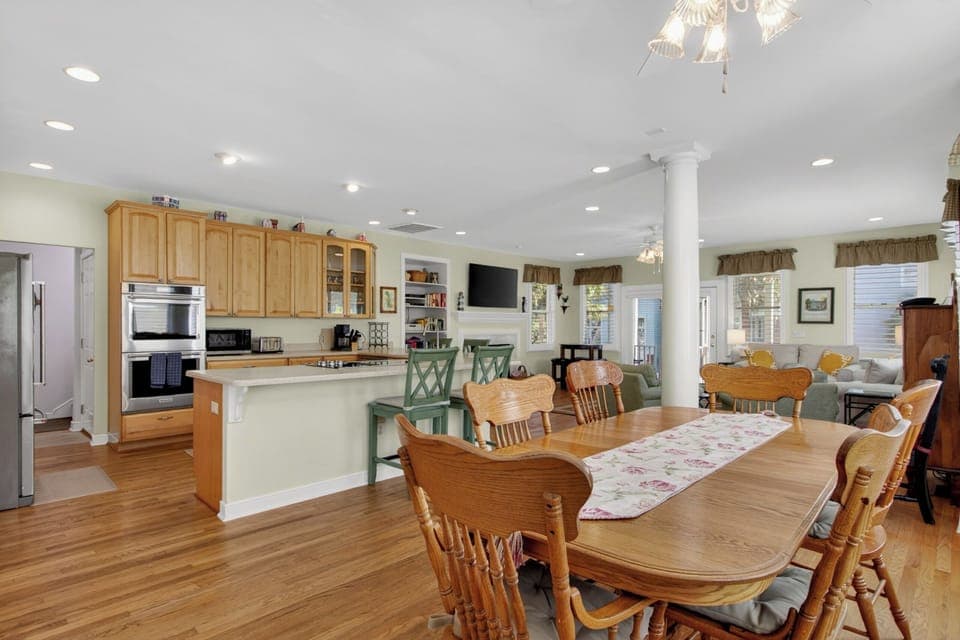 Gather around this spacious dining table where your group can share memorable meals in the open-concept heart of your home.