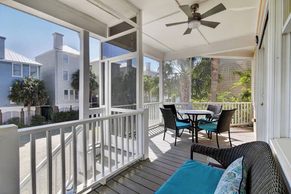 Relax on your screened porch with ceiling fan and comfortable seating, perfect for morning coffee or evening conversations.
